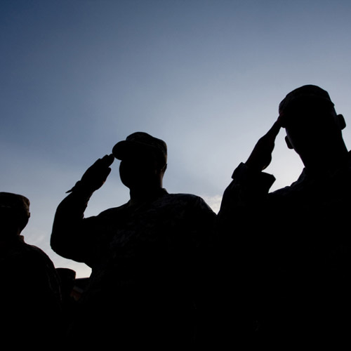 Saluting military silhouettes