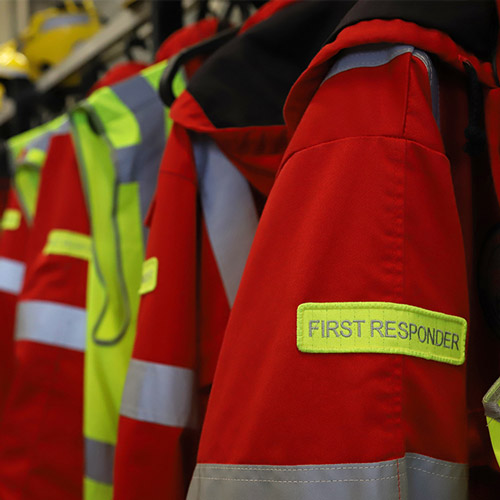 first responder jackets hanging on rack