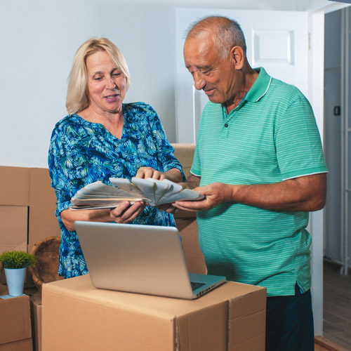 seniors moving with packed boxes