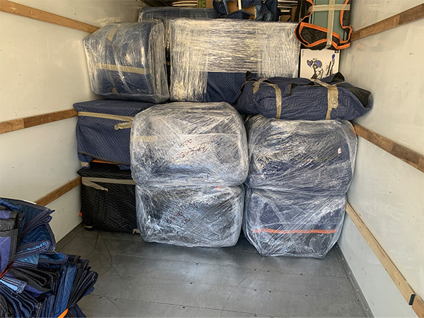 a quick reaction movers truck packed with items