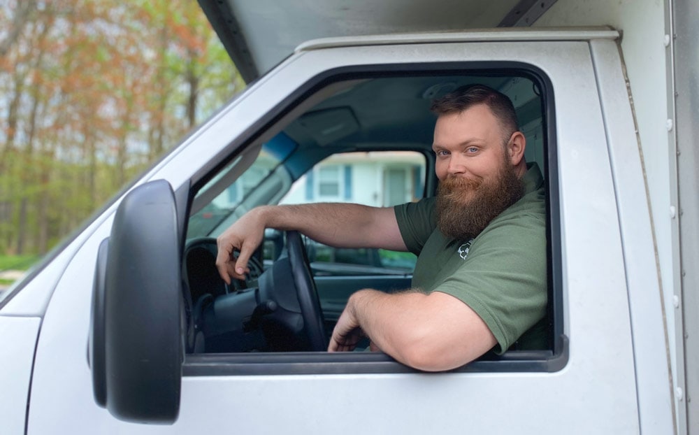 Quick Reaction mover in the driver's seat of a moving truck