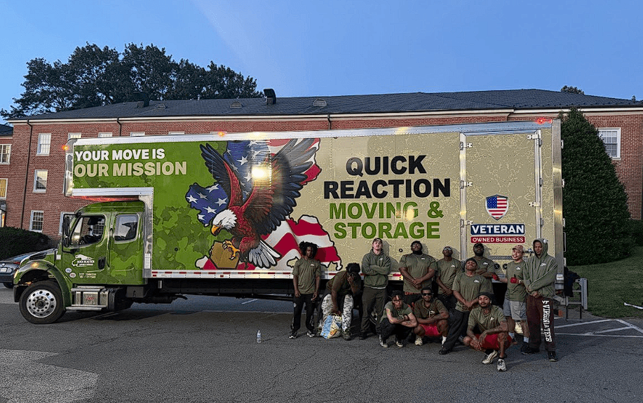Quick Reaction moving truck with American flag graphics and crew members